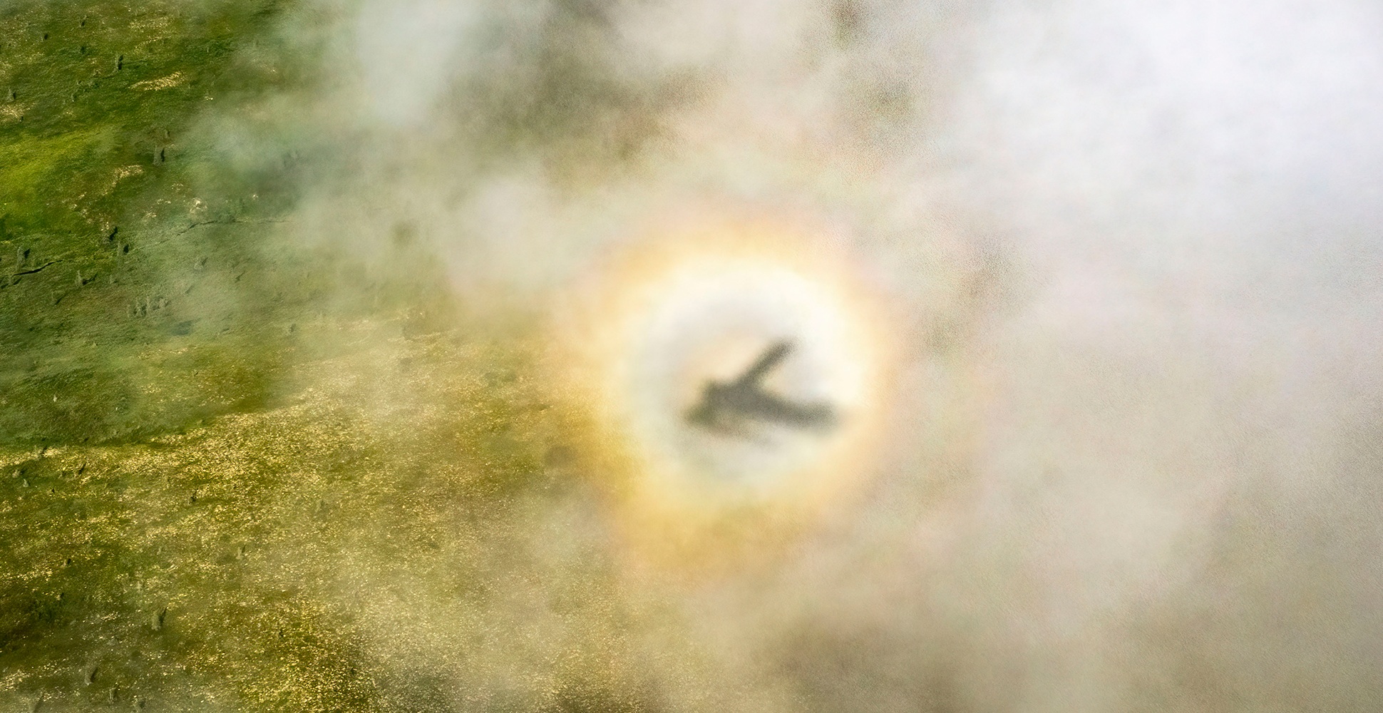 A Plane soars through the mist in Alaska