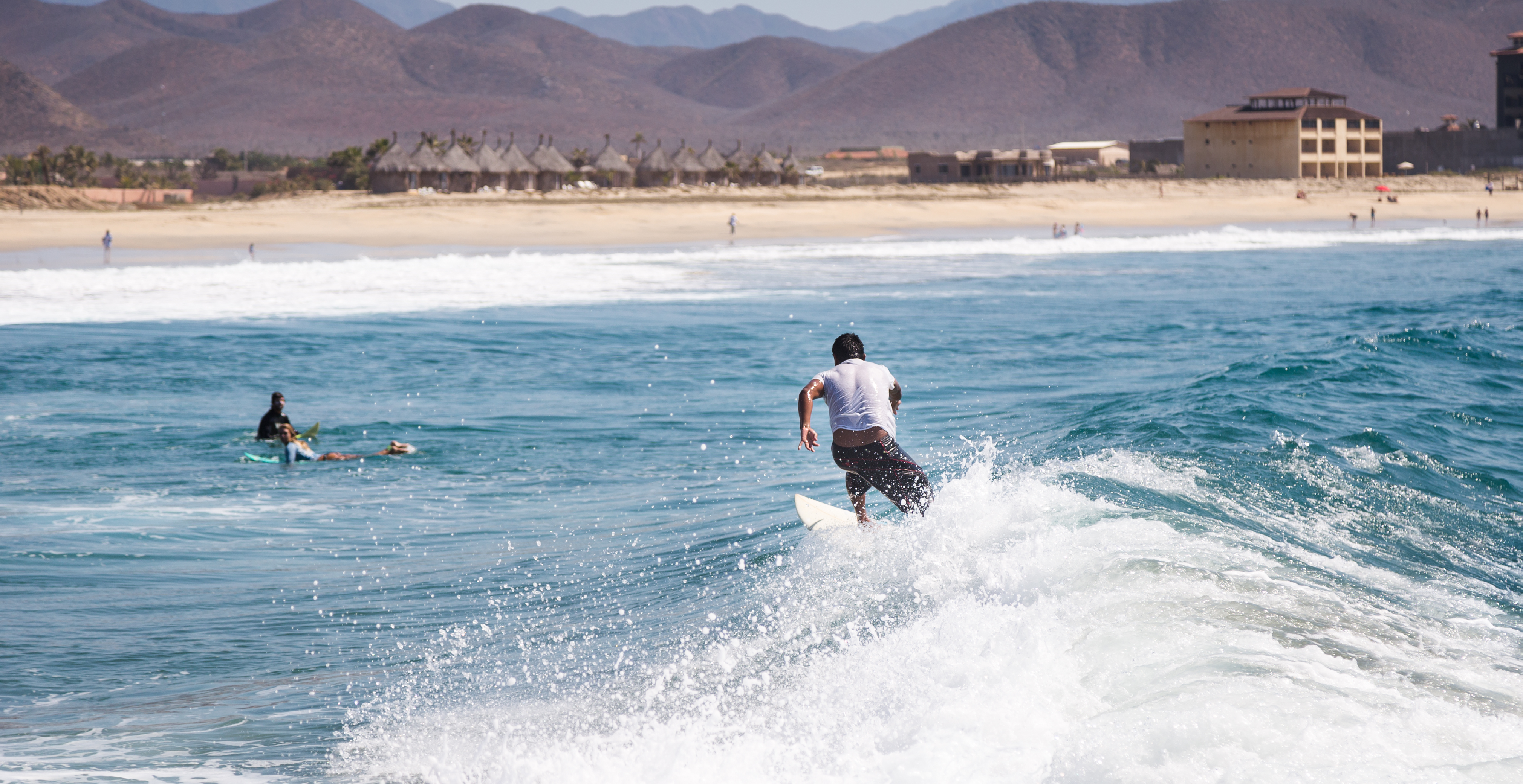 A Surfer Plays in the Surf of Baja California Sur